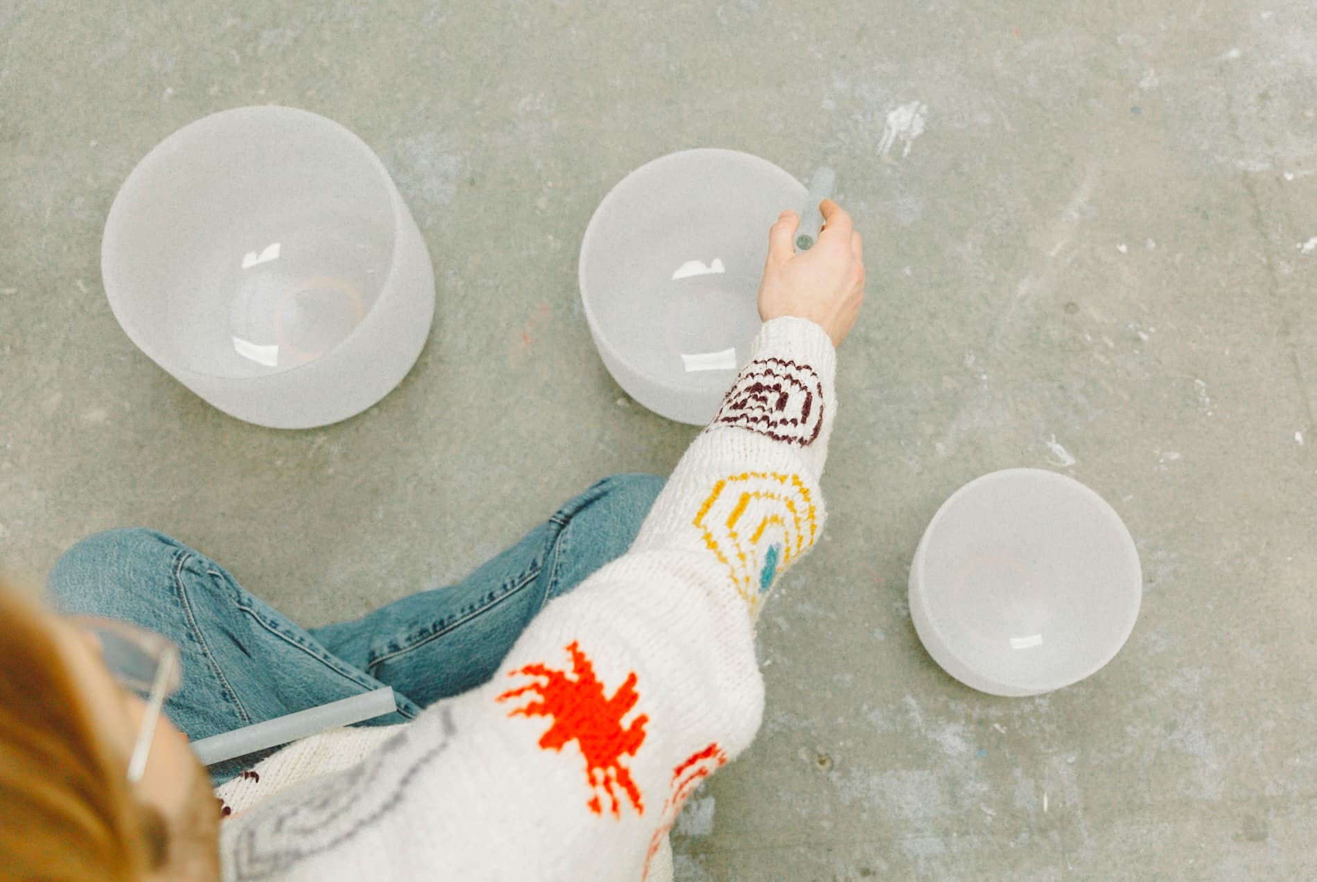 Crystal singing bowls being played